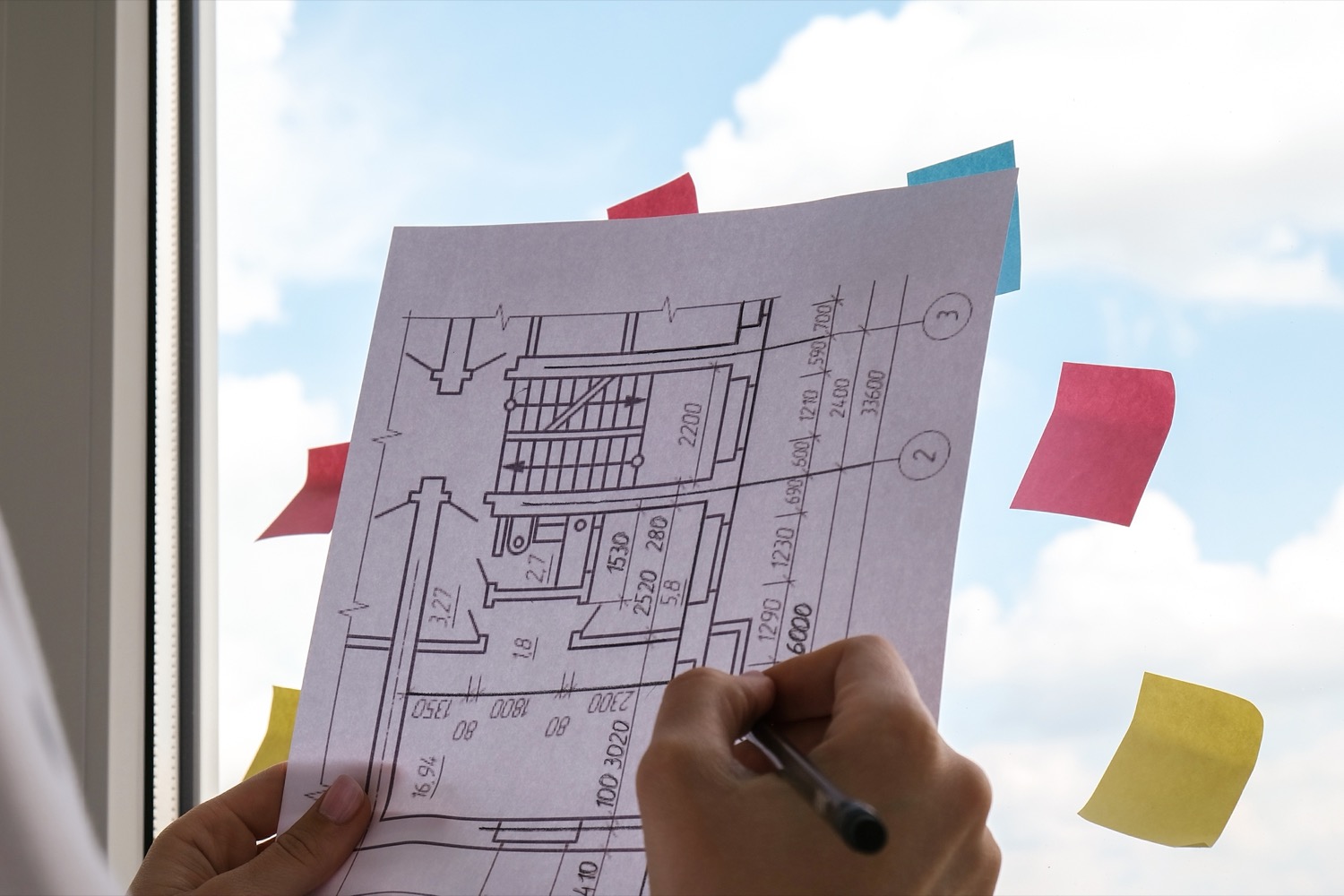 female-interior-designer-drawing-house-plan-in-off-2022-11-09-09-53-19-utc